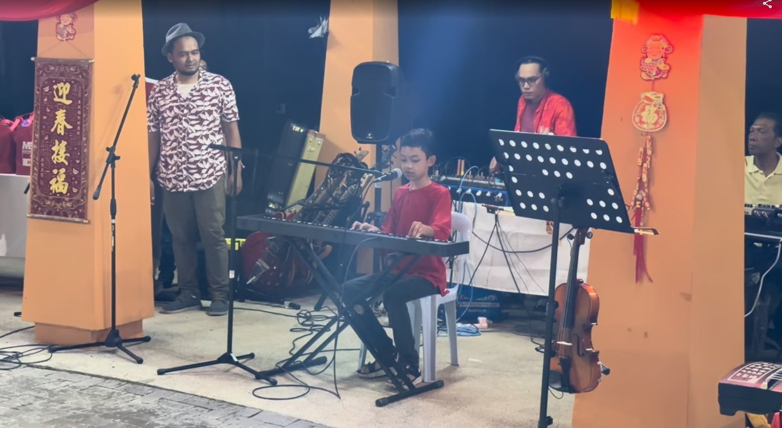 Raees Aryan Ezmir performing at a Chinese New Year celebration